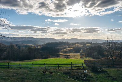 View of landscape against cloudy sky