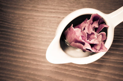 Close-up of flower in spoon