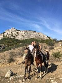 Horses riding horse