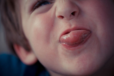 Close-up of boy making face