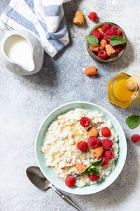Healthy diet breakfast. oatmeal porridge in ceramic bowl decorated with fresh berries raspberries. 