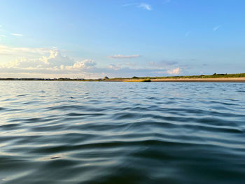 Scenic view of sea against blue sky