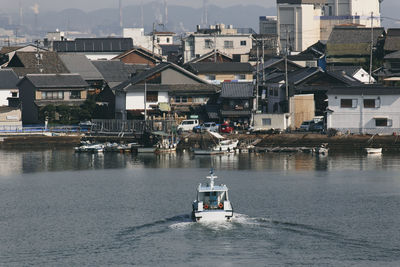 High angle view of buildings by sea