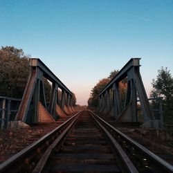 Railroad tracks against clear sky