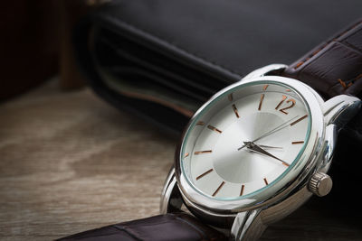 High angle view of clock on table