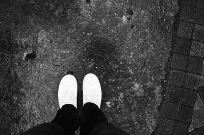 Low section of person standing on street