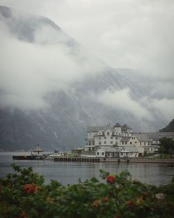 Buildings against cloudy sky
