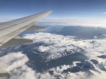 Aerial view of snowcapped mountains against sky