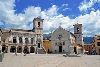 Facade of church against cloudy sky