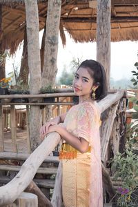 Girl in traditional clothing standing at park