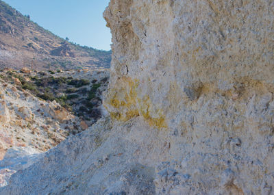 Rock formation on land against sky