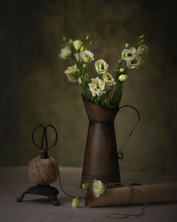 Close-up of flower vase on table