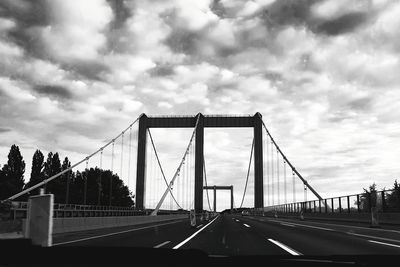 View of highway against cloudy sky