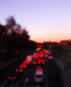 Defocused image of car on road at night