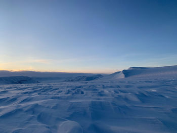 Scenic view of snowcapped mountain against sky during winter