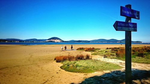 Scenic view of calm sea against clear blue sky