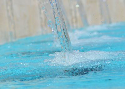 Close-up of water splashing in swimming pool