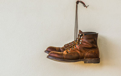 Close-up of shoes on wall