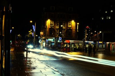 Light trails on city street at night