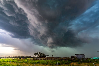 Storm clouds over field