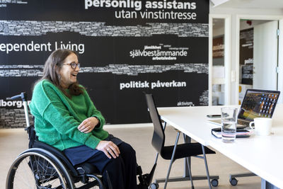 Disabled woman during meeting in office