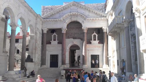 Tourists in front of building