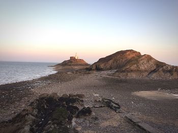 Scenic view of sea at sunset