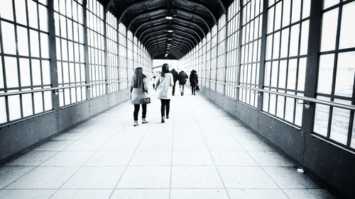 People walking on railroad station