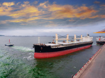 Ship moored on sea against sky