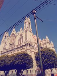 Low angle view of built structure against blue sky