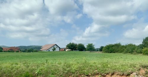 House on field against sky