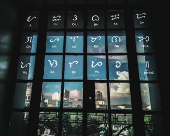 Full frame shot of clock against window