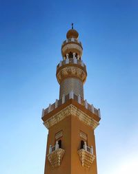 Low angle view of building against blue sky