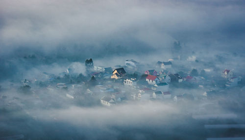 Aerial view of townscape during foggy weather