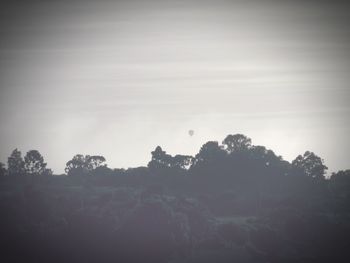 Silhouette trees against sky