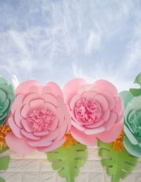 Close-up of pink roses against sky