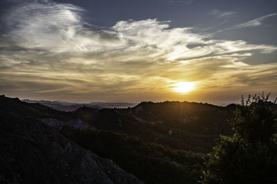 Scenic view of mountains against sky during sunset