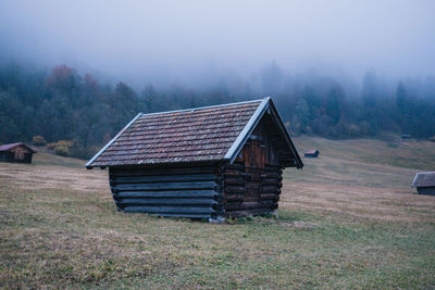 House on field against sky