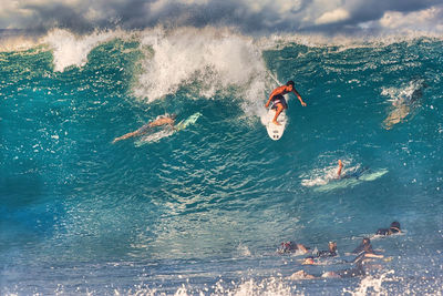 People swimming in sea