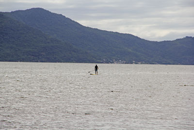 Man in mountains against sky