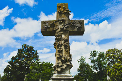 Low angle view of statue against sky