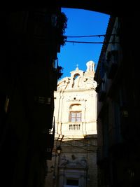 Low angle view of buildings against clear sky