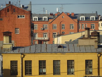 Low angle view of residential buildings against clear sky