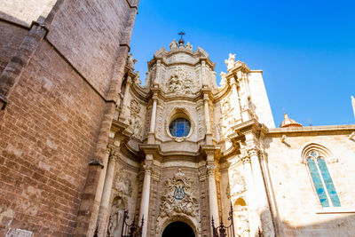 Low angle view of ornate building against sky