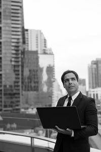 Man standing in front of building