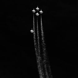 Low angle view of airplane flying against clear sky