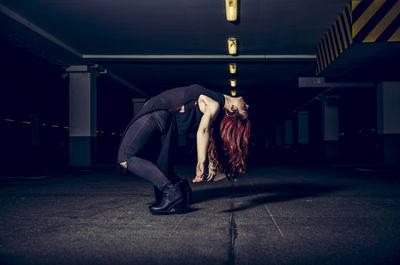 Woman posing in parking lot