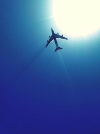 Low angle view of vapor trails in sky