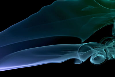 Close-up of light painting against black background