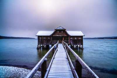 Pier over sea against sky